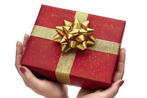 Gift box in woman hands isolated on white background. photo