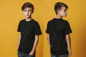 Boy in black t-shirt on yellow background. Mockup for design. photo