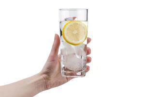 Glass of water with ice and lemon in hand isolated on white background. photo