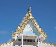 Gable sculpture on a temple pavilion in Thailand photo