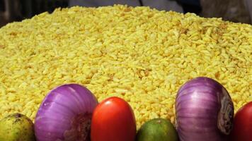 Vegetables and raw ingredients are displayed in a street food shop photo