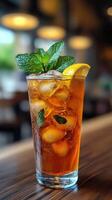 Refreshing iced tea with lemon slice in a cafe setting photo