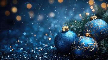 Christmas baubles and pine cones creating festive atmosphere on blue glitter photo