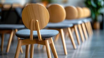 Row of empty chairs standing in a modern cafe photo