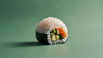Sushi roll with avocado and cucumber on a green background. photo