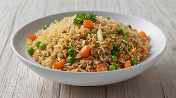 Vegetable fried rice with carrot, green peas and parsley photo