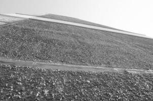 Red building wall. Black and white monochrome grayscale photo background.