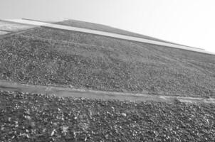 Red building wall. Black and white monochrome grayscale photo background.