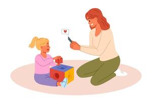 Happy mother takes photo of little daughter playing with blocks on mobile phone camera vector