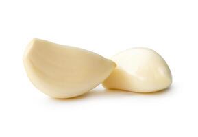 Side view of white garlic cloves in stack isolated on white background with clipping path photo