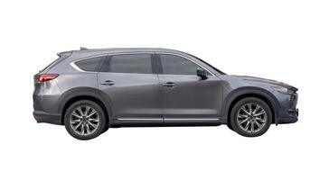 Side view of dark gray hatchback car isolated on white background with clipping path photo