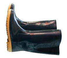 A pair of black gumboots or black boots for working in garden isolated on white background with clipping path photo