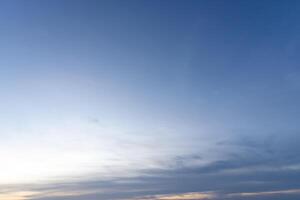 Low angle view of beautiful blue and orange sky with strange shape of clouds while sunsets or sunrises in the morning or evening used as natural background texture in decorative art work photo