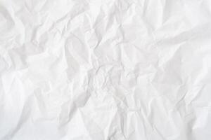 Top view of wrinkled or crumpled white stencil paper used for wrinkled or crumpled white paper background texture photo