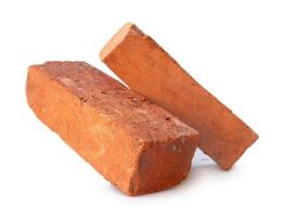 Side view of old red or orange bricks in stack isolated on white background with clipping path photo