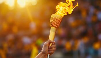 hand holding torch with burning flame photo