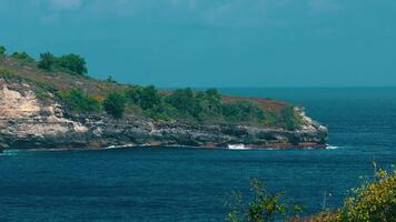 Scenic Coastal View with Rocky Cliffs and Lush Greenery video