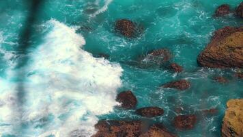 Turquoise Ocean Waves Crashing on Rocks video