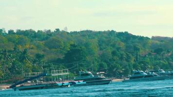 Scenic Coastal View with Boats and Green Hills video