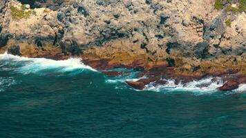 Aerial View of Rocky Coastline with Crashing Waves video