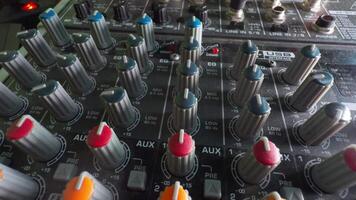 Control panel with many controls on audio mixer. video