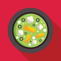 Green soup with cheese, vegetables and spices in bowl over red background vector