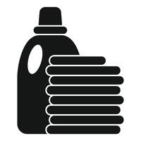 Laundry detergent standing next to a pile of clean clothes vector