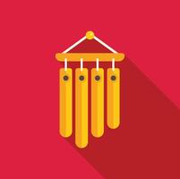 Golden wind chime hanging with a red background vector