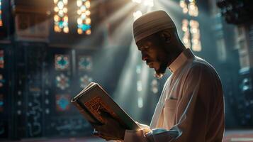 A Muslim man is reading the Quran in a peaceful setting with a dim and serene nighttime background. photo
