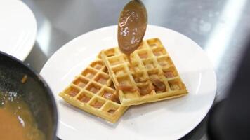 Drizzle caramel over waffles process of making waffles. Belgian waffles cooking process Bake waffles video