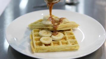 Drizzle caramel over waffles process of making waffles. Belgian waffles cooking process Bake waffles video