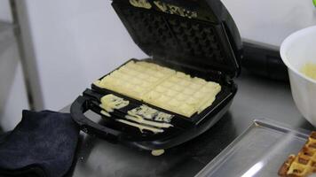 Drizzle caramel over waffles process of making waffles. Belgian waffles cooking process Bake waffles video