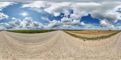spherical 360 hdri panorama on side of gravel road with rain storm clouds in dark sky in equirectangular seamless projection, as skydome replacement in drone panoramas, game development photo