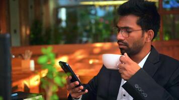 Man Enjoying Coffee While Using Mobile video