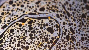 Colorful abstract art of liquid soap bubbles with psychedelic patterns, surreal moving patterns video
