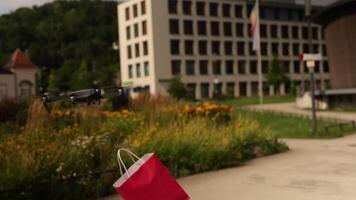 Modern technological delivery innovation - drone fast delivery concept, two multicopters and box video