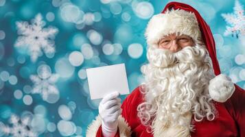 Santa Claus Holding an Empty White Card with Snowflakes and Blue Background. Concept of Christmas, Winter Holiday, Festive Greetings, Santa Messages. Greeting card, mockup, invitation. Copy space photo