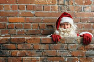 Santa Claus Peeking Over Empty Brick Wall. Concept of Christmas, Holiday Cheer, Festive Season. Greeting card, postcard, mockup, invitation. Copy space photo