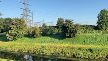 High-voltage pylons with sewer in the countryside video