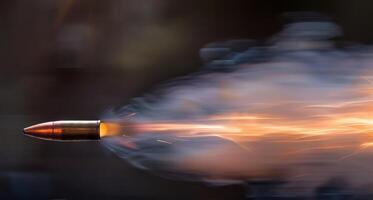 Close-Up of a Flying Bullet with Sparks and Smoke Trail. Concept of Ammunition, Firearms, Ballistics, Shooting Accuracy photo