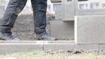 the foundation of the house is made of concrete blocks bound with metal armature video