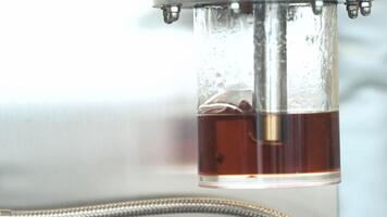 bubbling oil in a glass container video