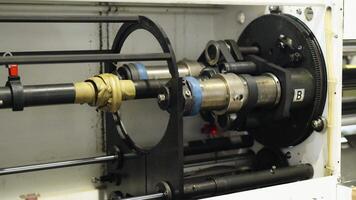 a rotating shaft switching processes in a mechanical machine on a factory video