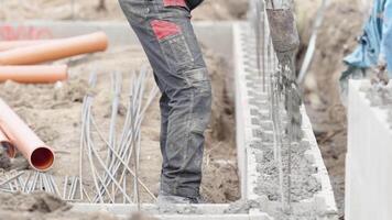 concreting from the pipe of the foundation of the building from the lost formwork video