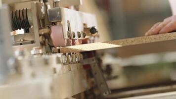machine treatment of the edge of the laminate board in carpentry video