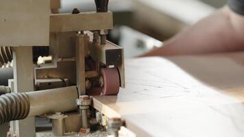 machine treatment of the edge of the laminate board in carpentry video