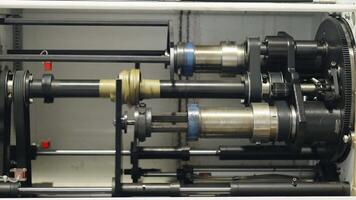 a rotating shaft switching processes in a mechanical machine on a factory video