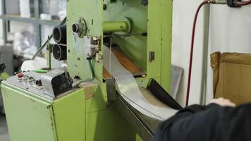 robotically automated machine for the production of plastic bags in a factory video