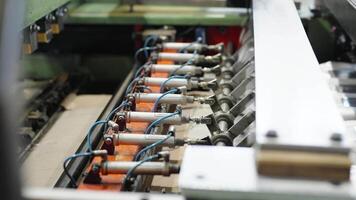 robotically automated machine for the production of plastic bags in a factory video