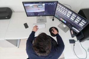 professional editor enhancing digital footage using specialized software photo